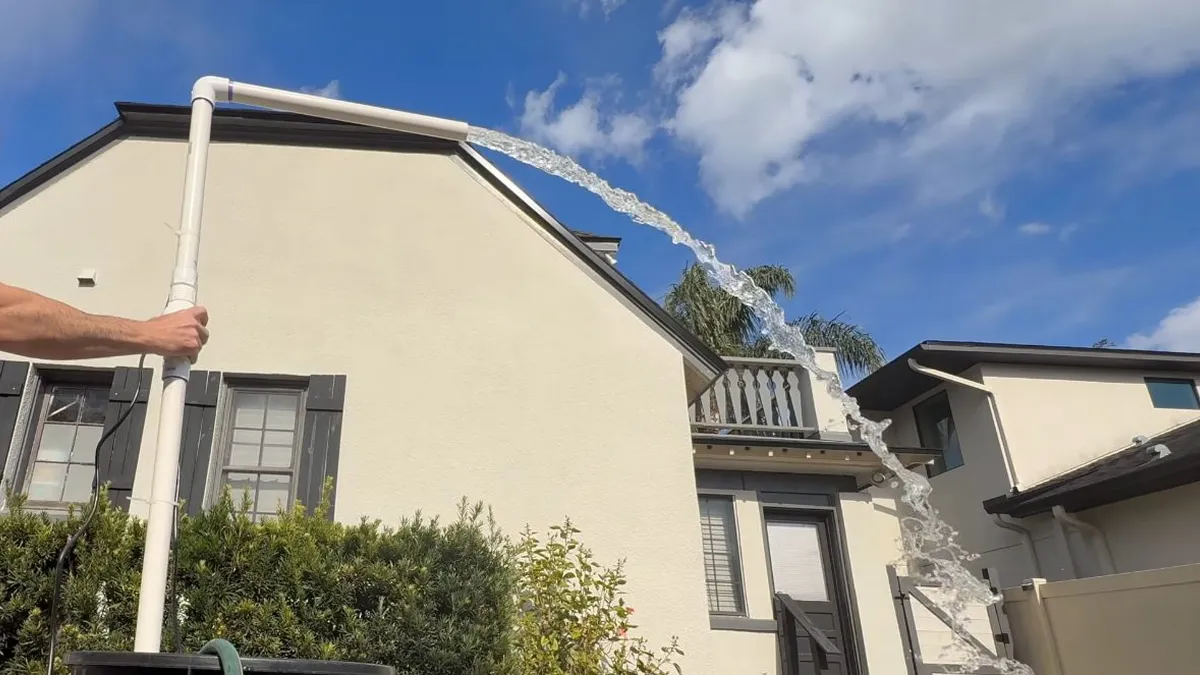 multi-story residential building exterior shows roof drainage and utility lines for Maricopa Plumbing Pros